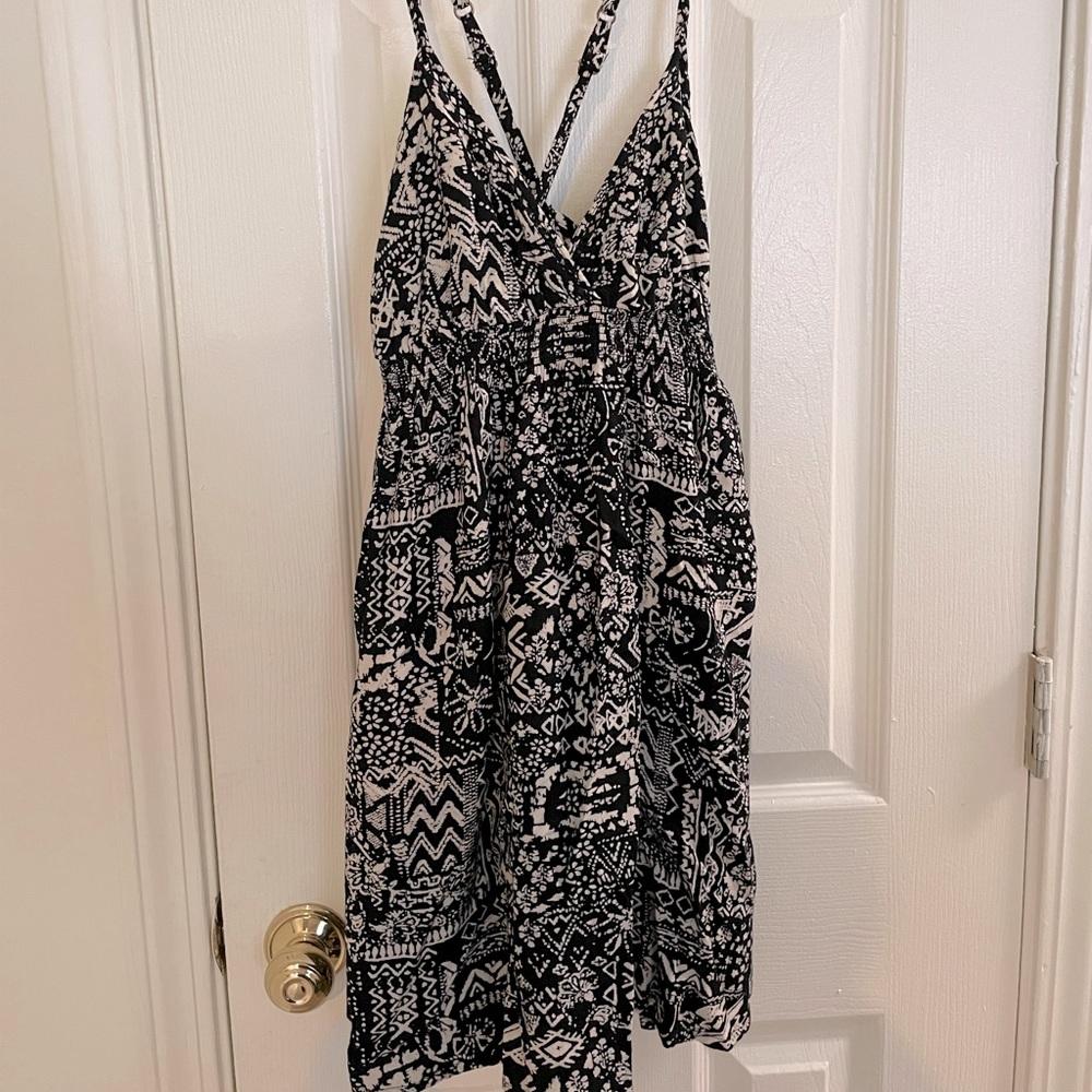 Black & tan, patterned, short halter dress.